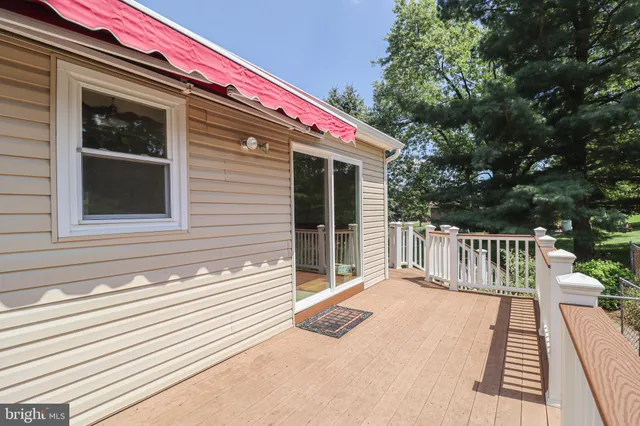 a view of a porch with furniture and a fireplace