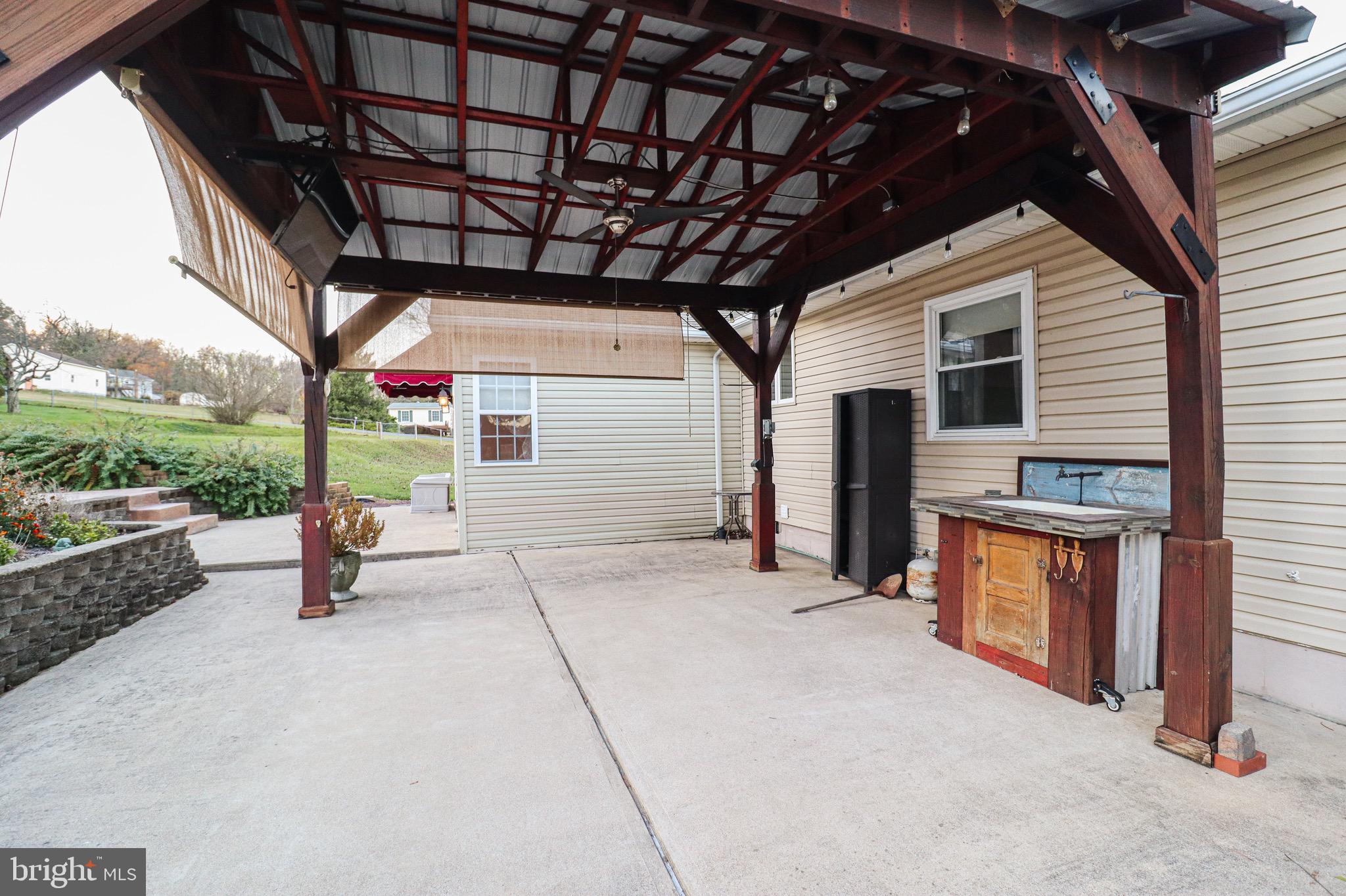 170 Donrene Road Mount Wolf, PA 17347 - Photo 55 of 71 a view of a porch with furniture and a fireplace