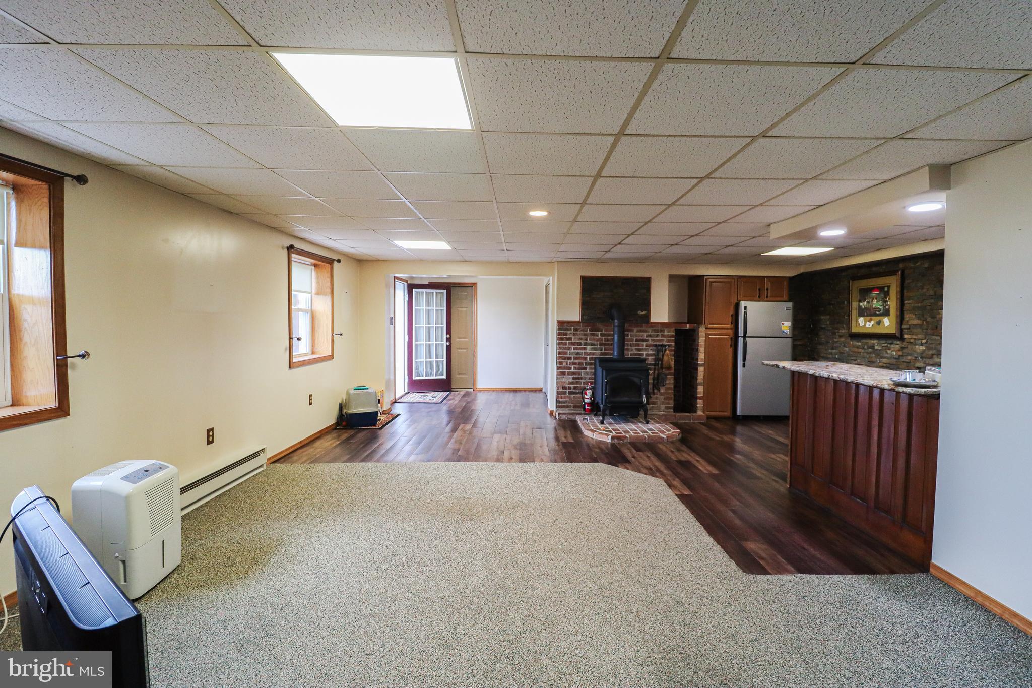170 Donrene Road Mount Wolf, PA 17347 - Photo 9 of 71 a spacious bedroom with a bed and a chandelier