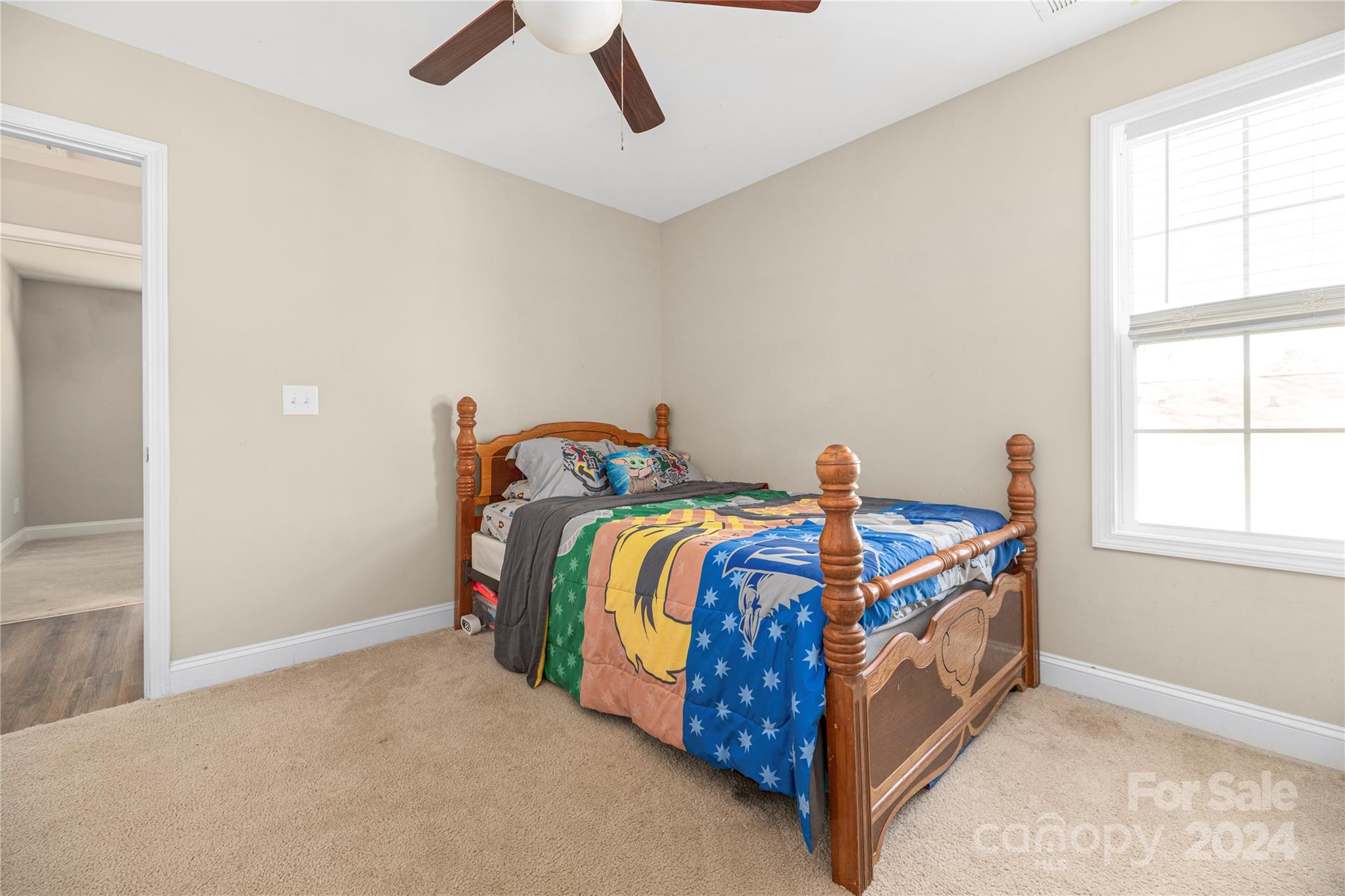283 Sunderland Road Southwest Concord, NC 28027 - Photo 19 of 27 a bed room with a bed and a window