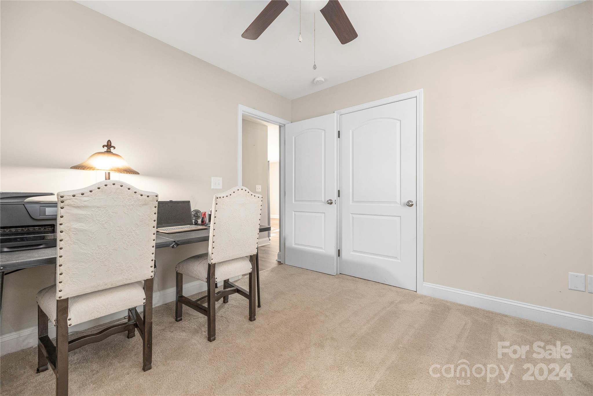 283 Sunderland Road Southwest Concord, NC 28027 - Photo 24 of 27 a view of a livingroom with furniture and chandelier fan