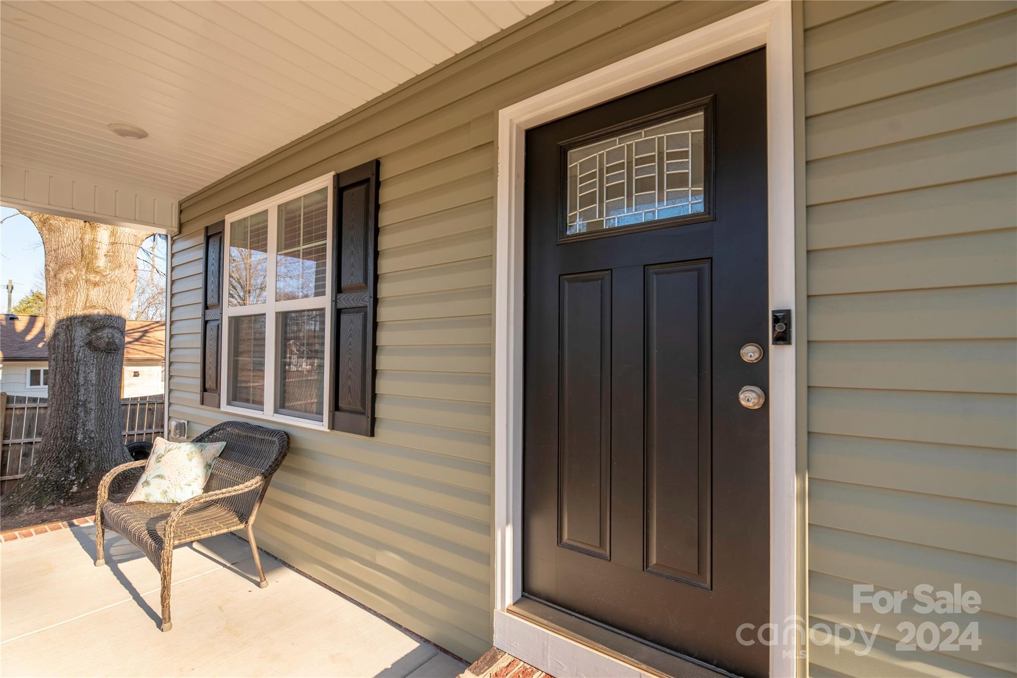 283 Sunderland Road Southwest Concord, NC 28027 - Photo 3 of 27 a view of front door with chair and table
