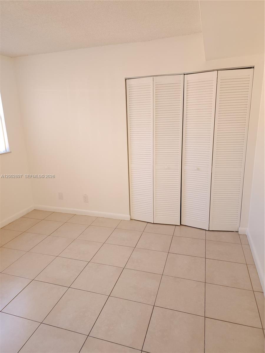 4505 Treehouse Lane, Unit 8H Tamarac, FL 33319 - Photo 14 of 29 a view of an empty room