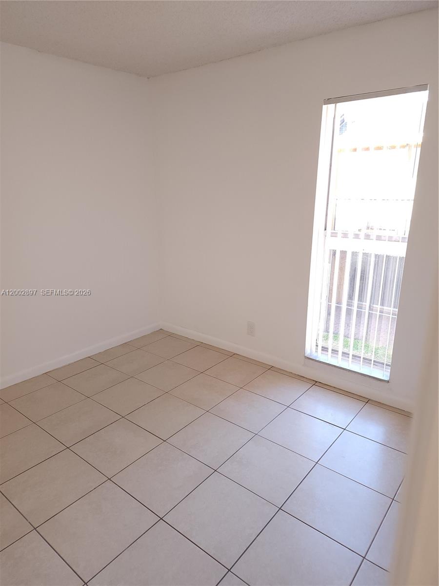 4505 Treehouse Lane, Unit 8H Tamarac, FL 33319 - Photo 15 of 29 a view of a room that has a window in it