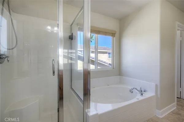 a bathroom with a bathtub and a shower