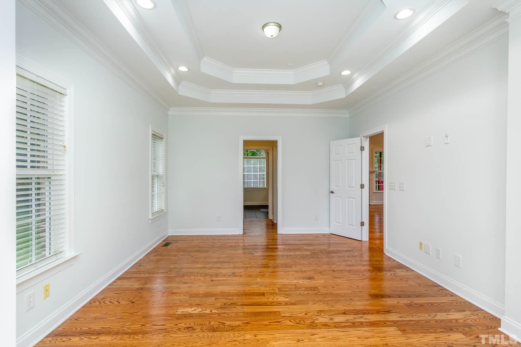 320 Government Road Clayton, NC 27520 - Photo 18 of 48 a view of an empty room with window and wooden floor