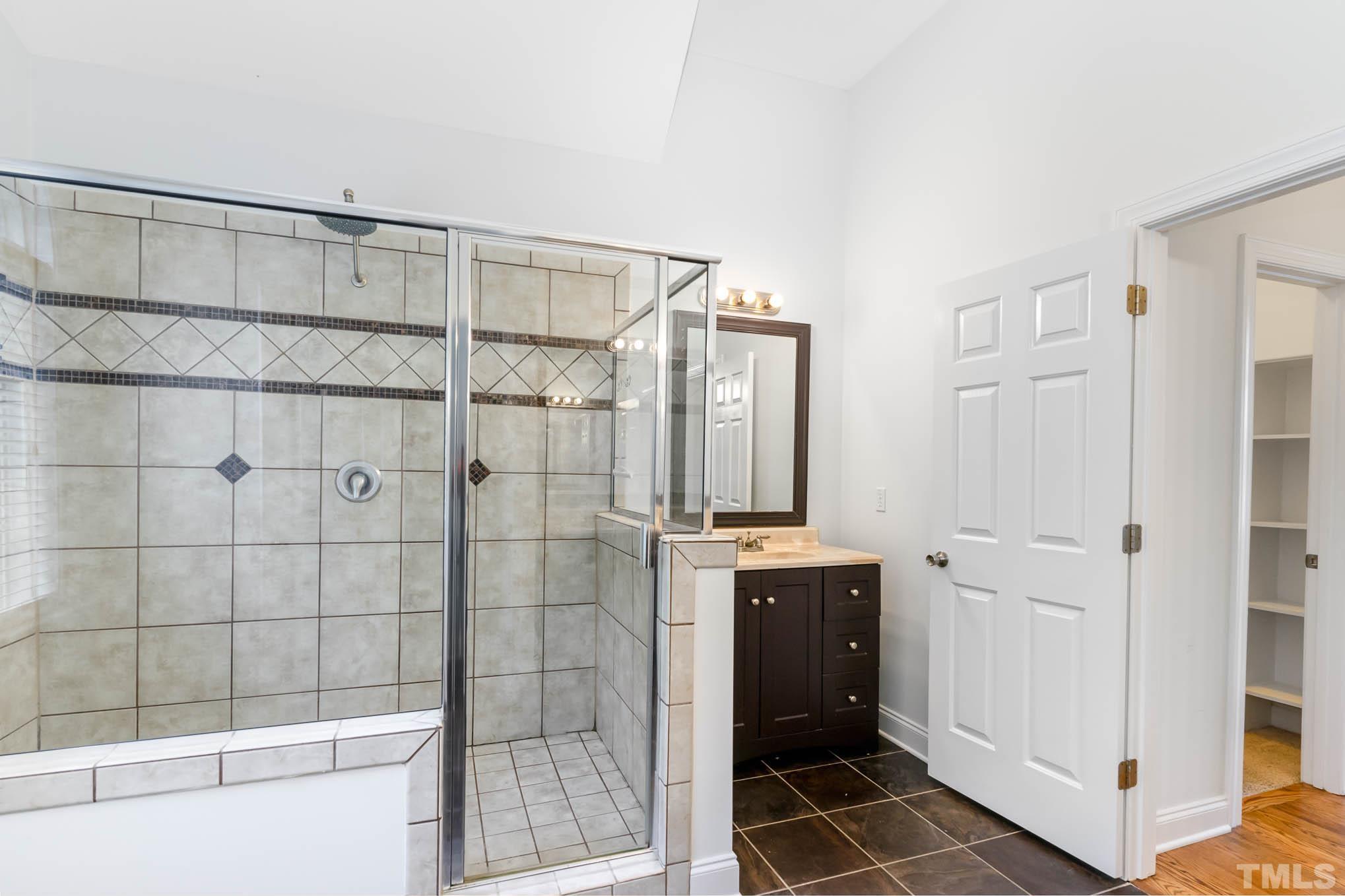 320 Government Road Clayton, NC 27520 - Photo 20 of 48 a bathroom with a shower and a sink