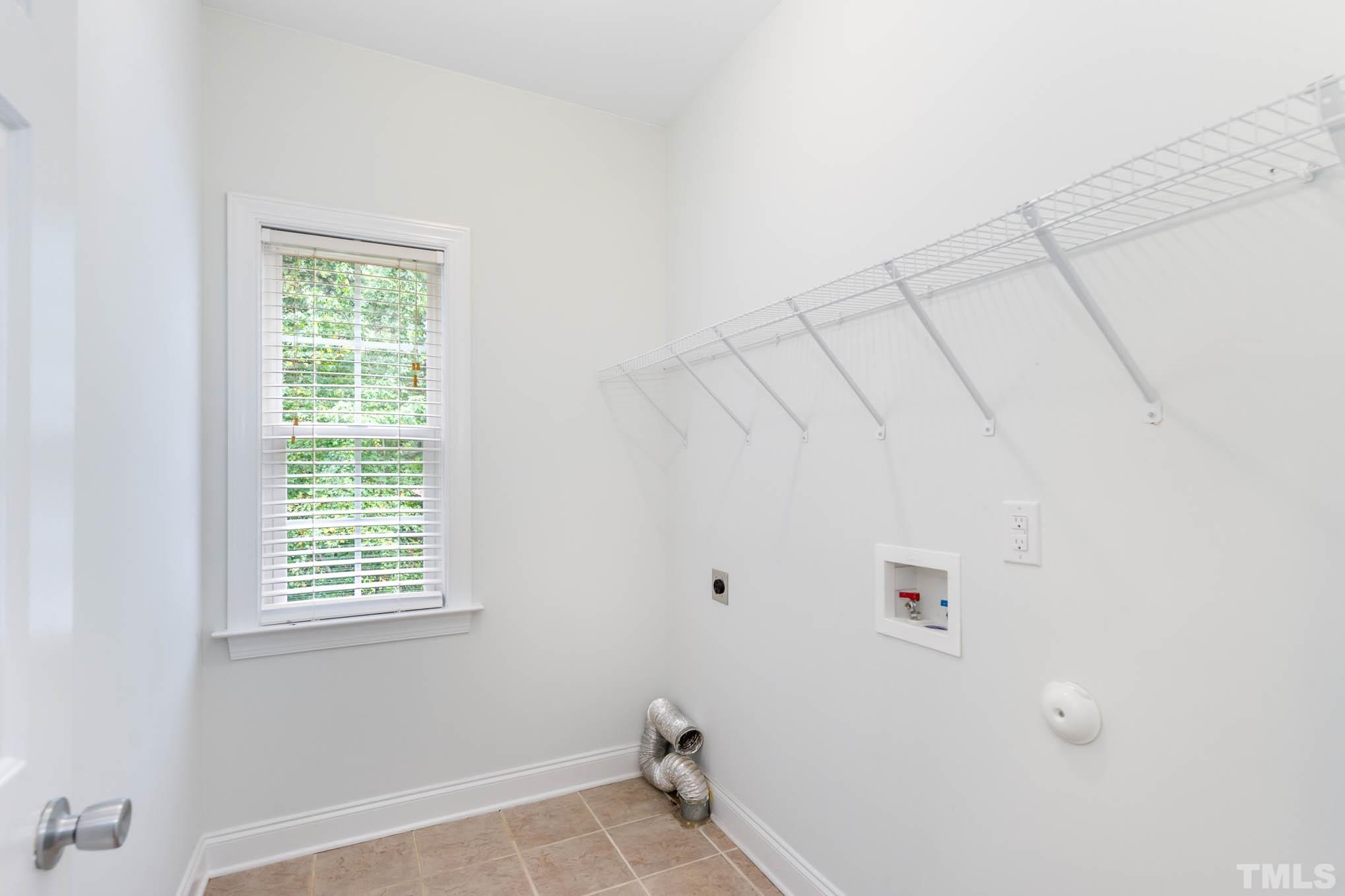 320 Government Road Clayton, NC 27520 - Photo 21 of 48 a view of an empty room with a window