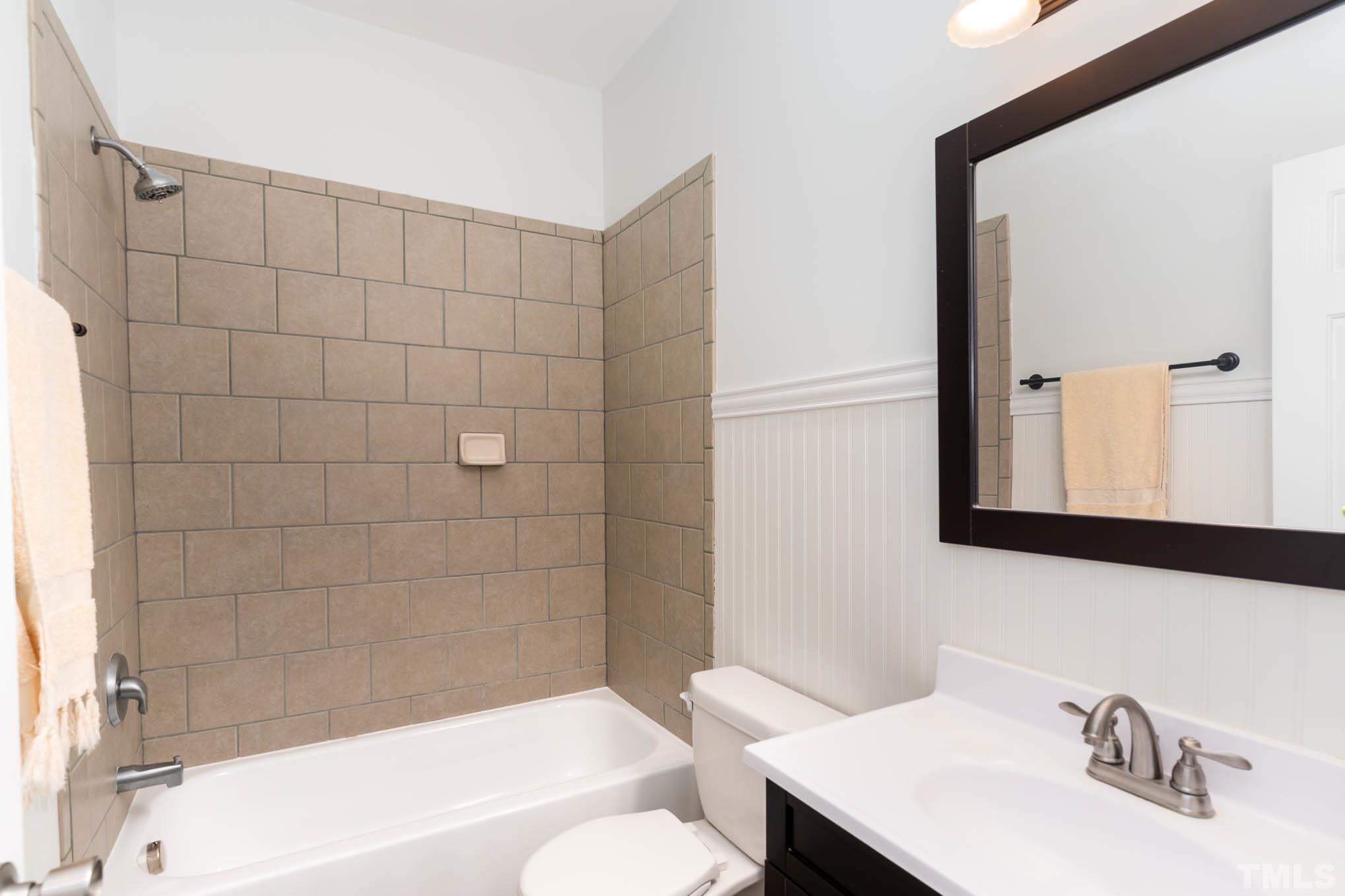 320 Government Road Clayton, NC 27520 - Photo 22 of 48 a bathroom with a sink a toilet and shower
