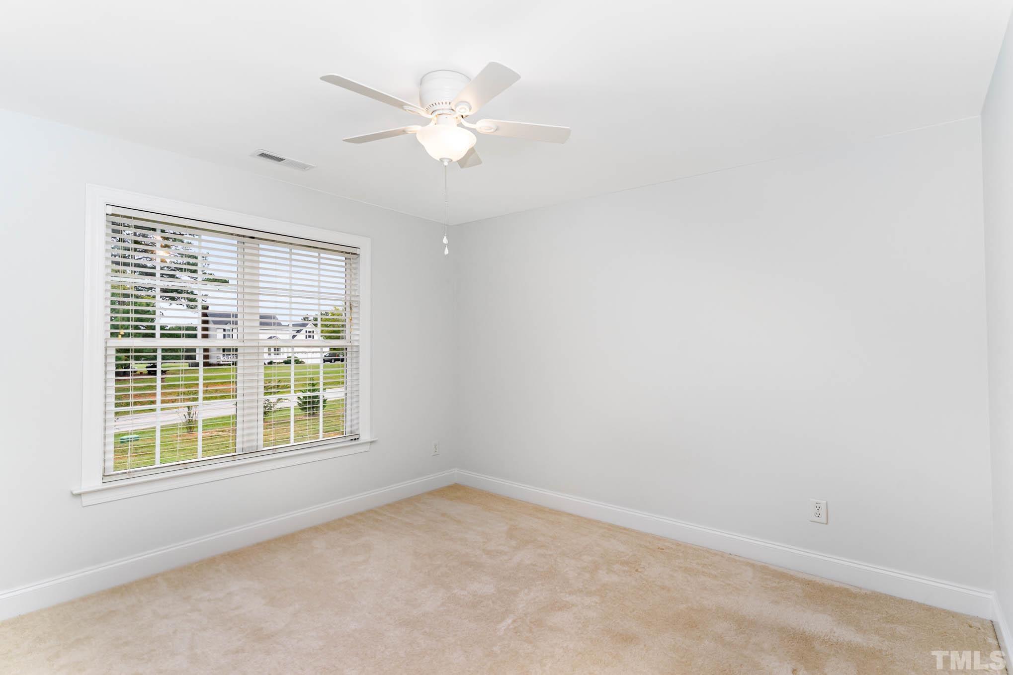 320 Government Road Clayton, NC 27520 - Photo 24 of 48 an empty room with a window