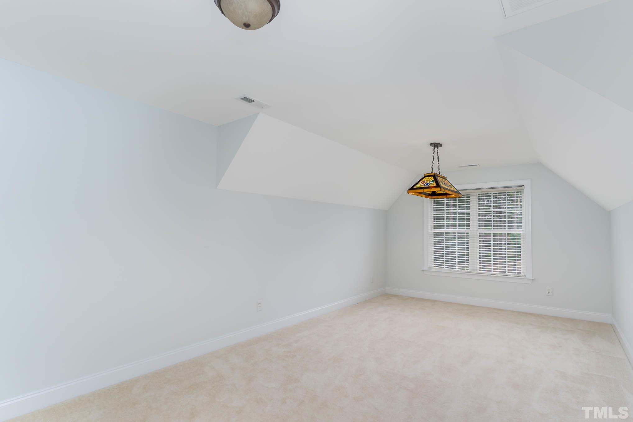 320 Government Road Clayton, NC 27520 - Photo 25 of 48 a view of an empty room with a window