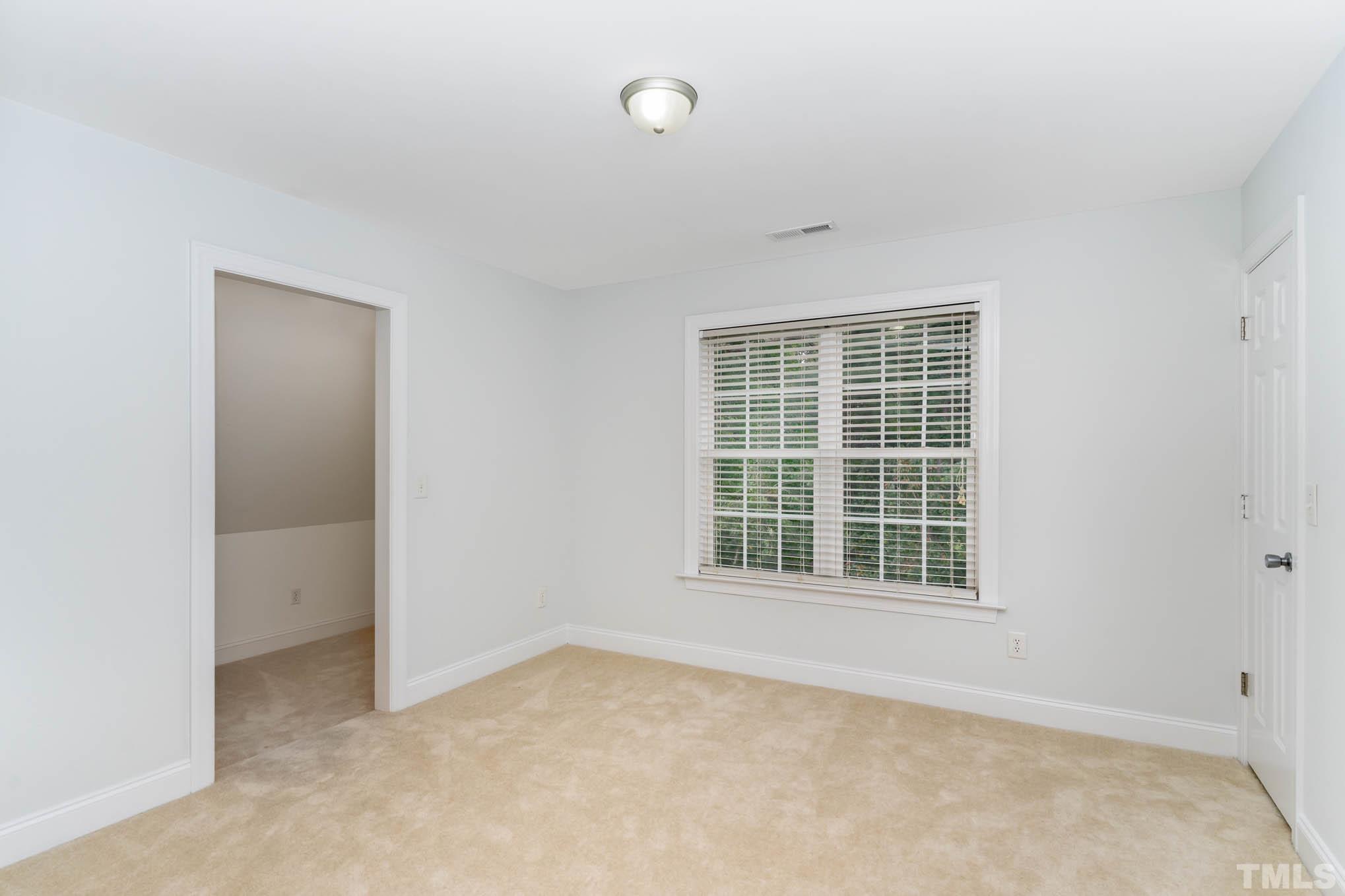 320 Government Road Clayton, NC 27520 - Photo 26 of 48 an empty room with a window
