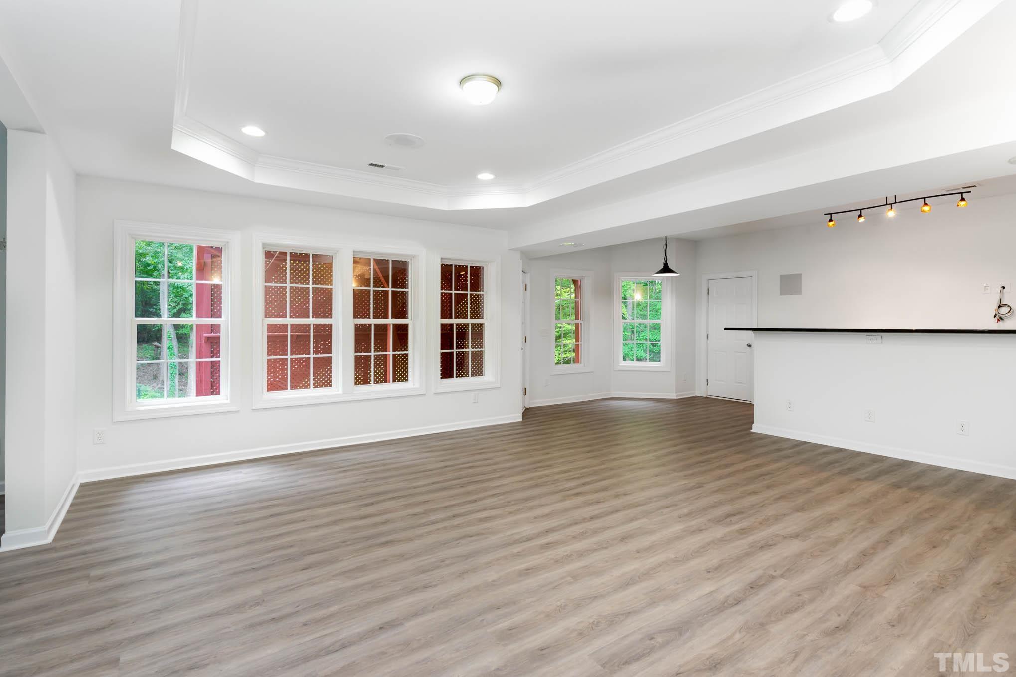 320 Government Road Clayton, NC 27520 - Photo 29 of 48 wooden floor in an empty room with a window