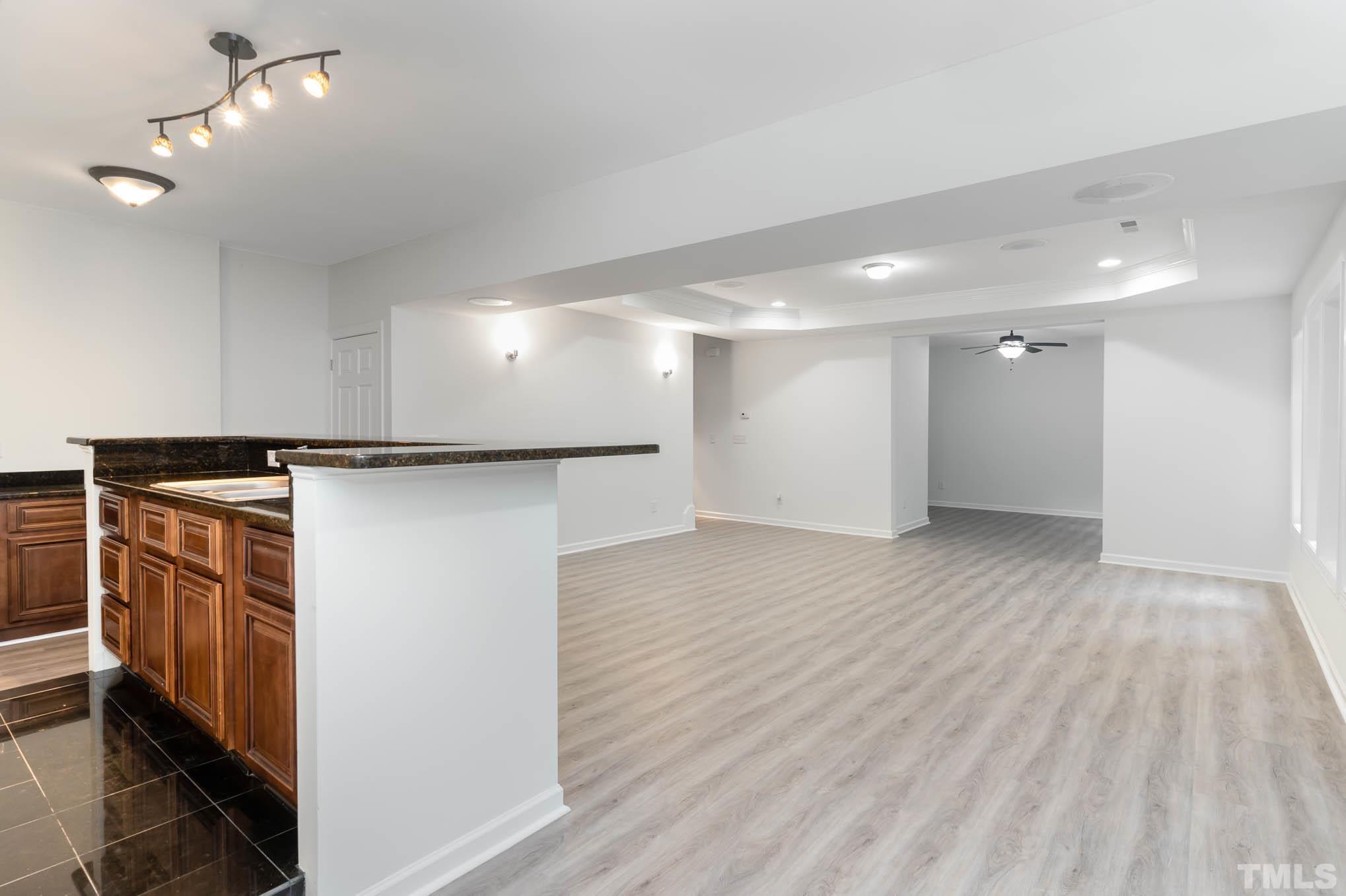 320 Government Road Clayton, NC 27520 - Photo 30 of 48 a view of a refrigerator in kitchen and an empty room