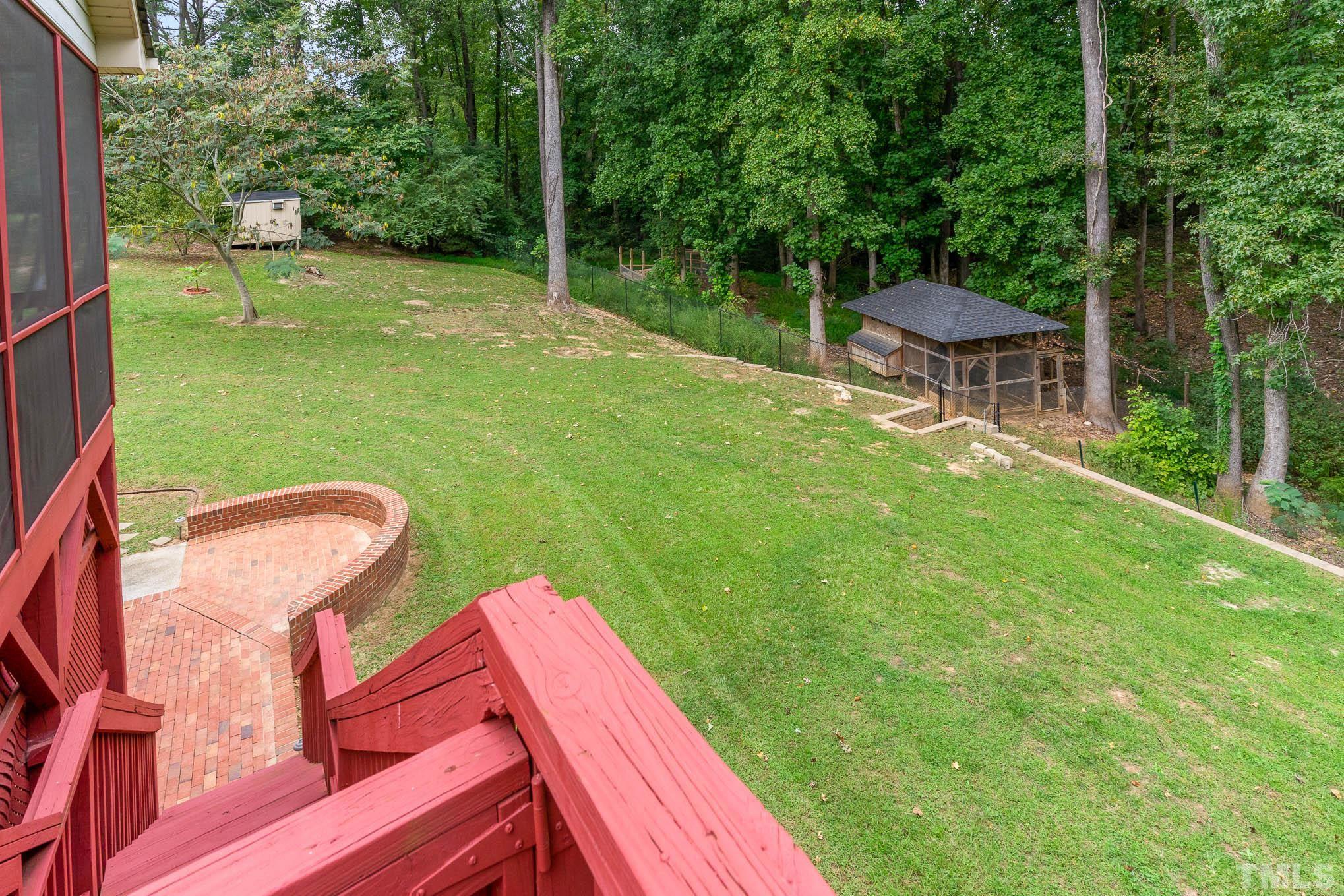 320 Government Road Clayton, NC 27520 - Photo 39 of 48 a backyard of a house with table and chairs