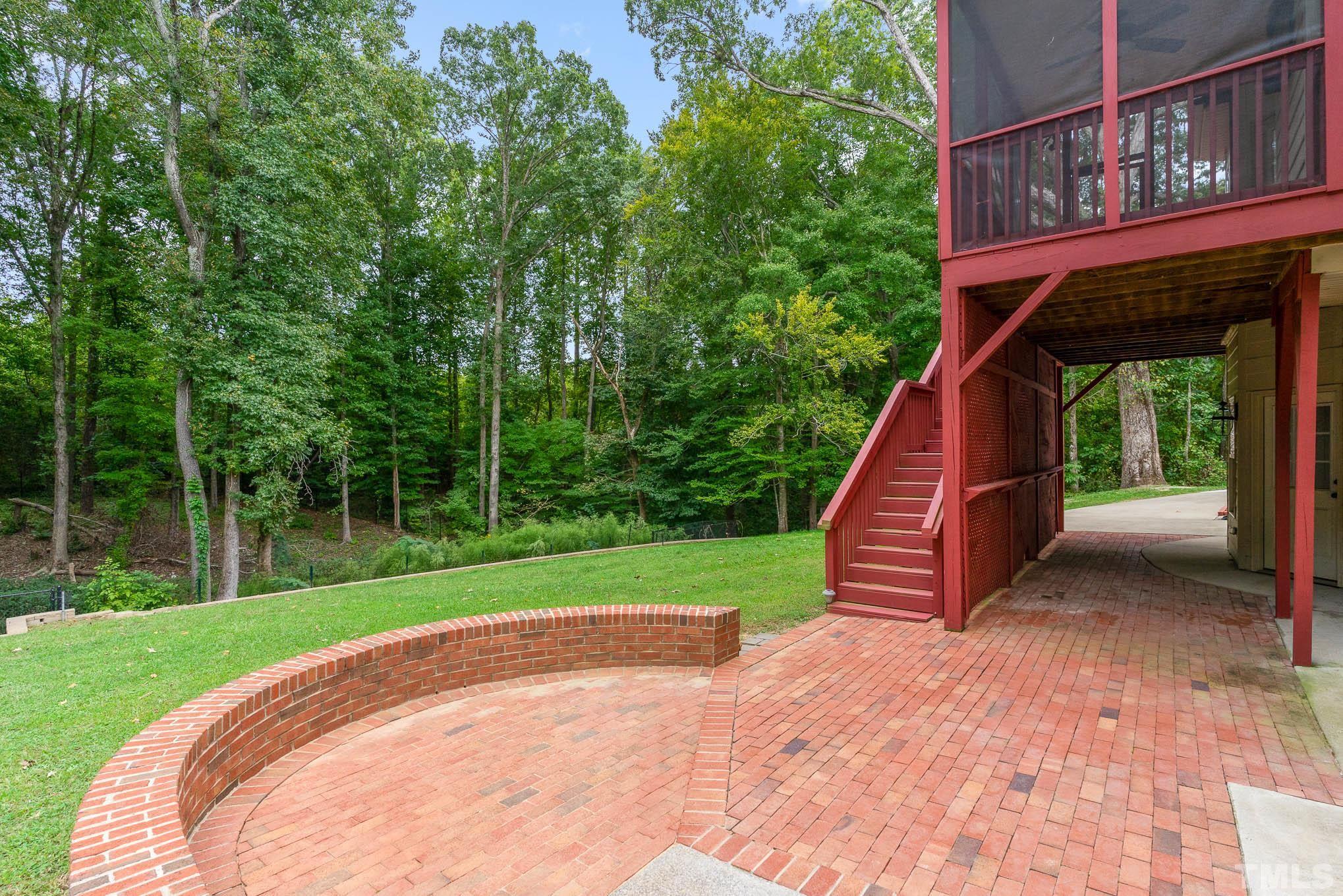 320 Government Road Clayton, NC 27520 - Photo 40 of 48 a view of a backyard with a small cabin