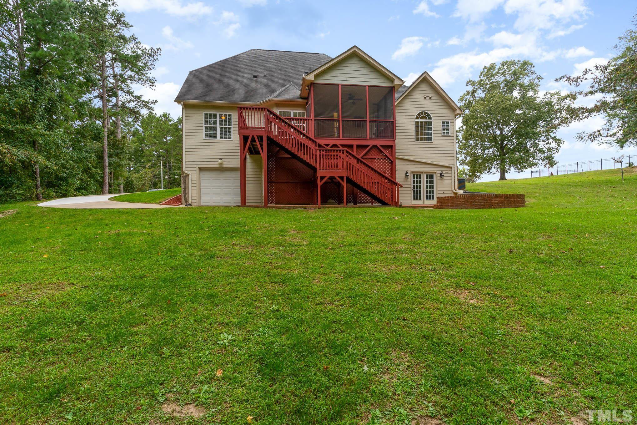 320 Government Road Clayton, NC 27520 - Photo 42 of 48 a front view of a house with yard
