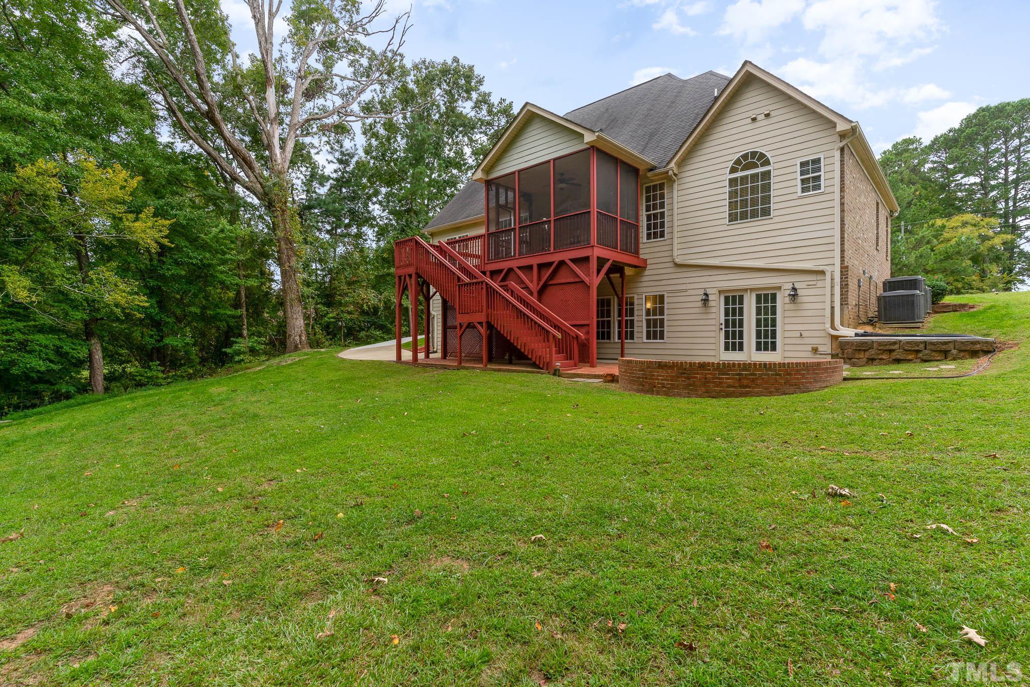 320 Government Road Clayton, NC 27520 - Photo 44 of 48 a front view of house with yard and green space