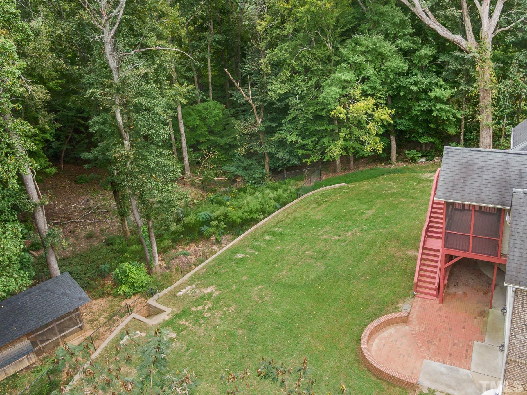320 Government Road Clayton, NC 27520 - Photo 47 of 48 a backyard of a house with table and chairs