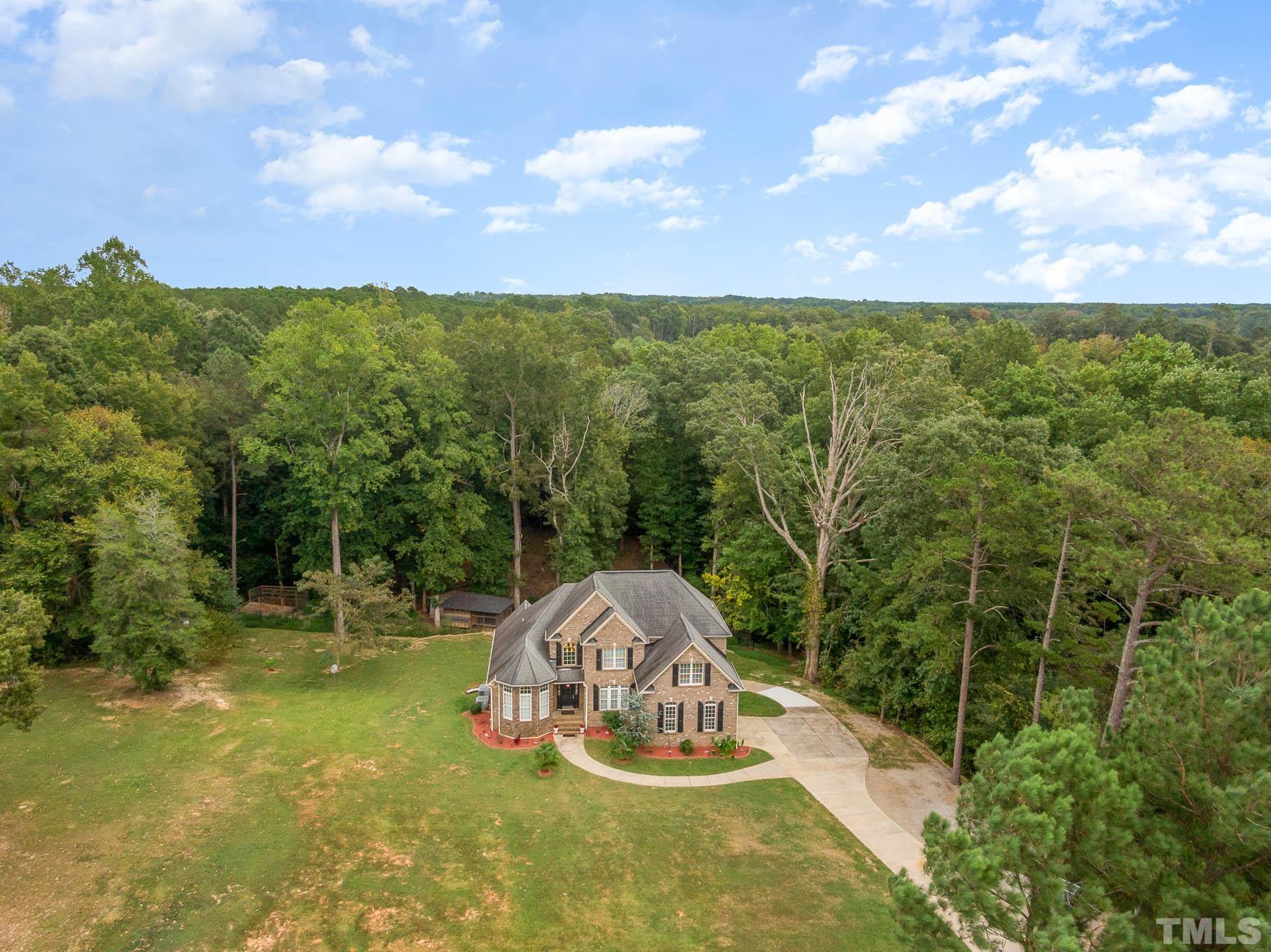 320 Government Road Clayton, NC 27520 - Photo 5 of 48 a view of a garden with houses