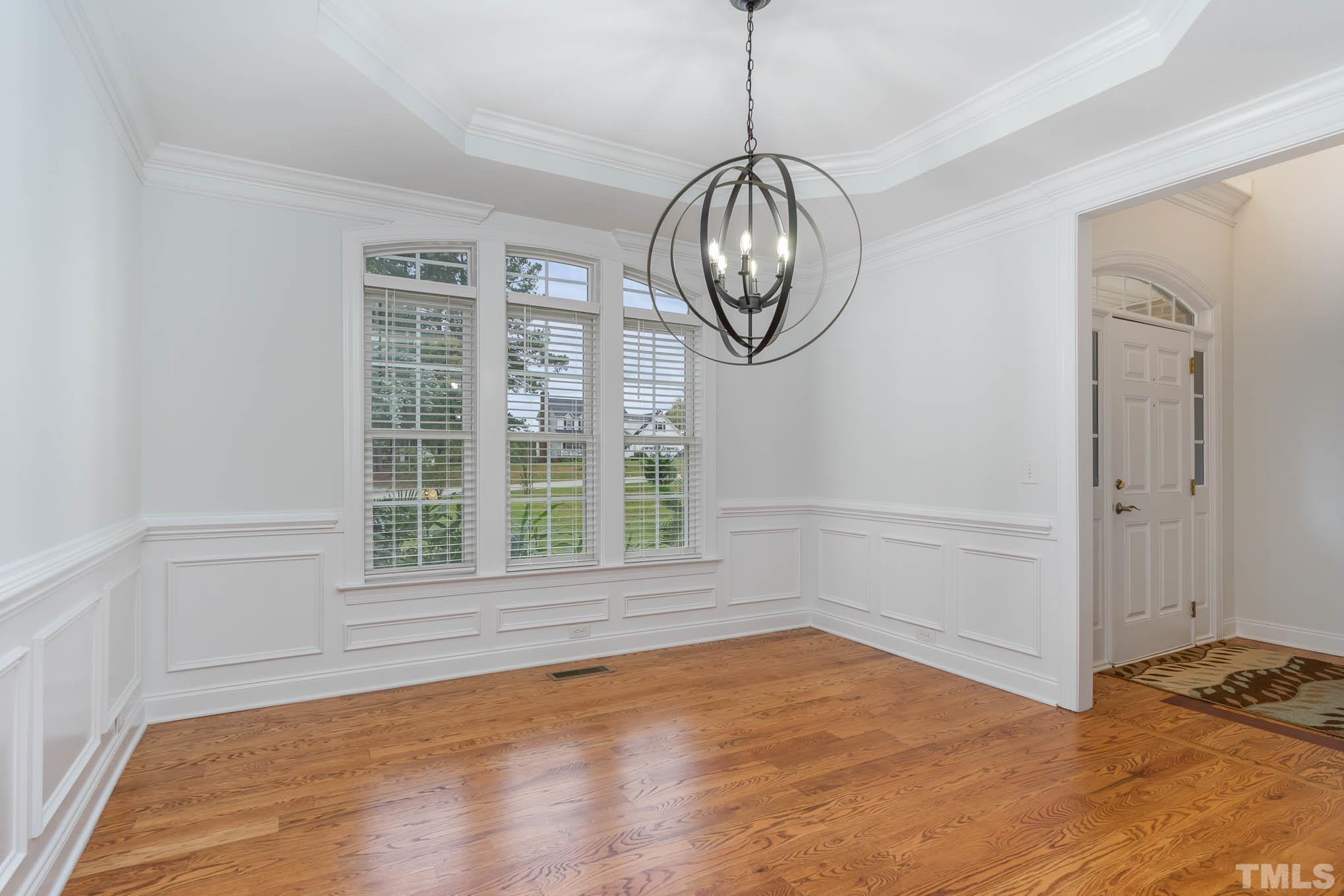 320 Government Road Clayton, NC 27520 - Photo 9 of 48 a view of empty room with wooden floor and window