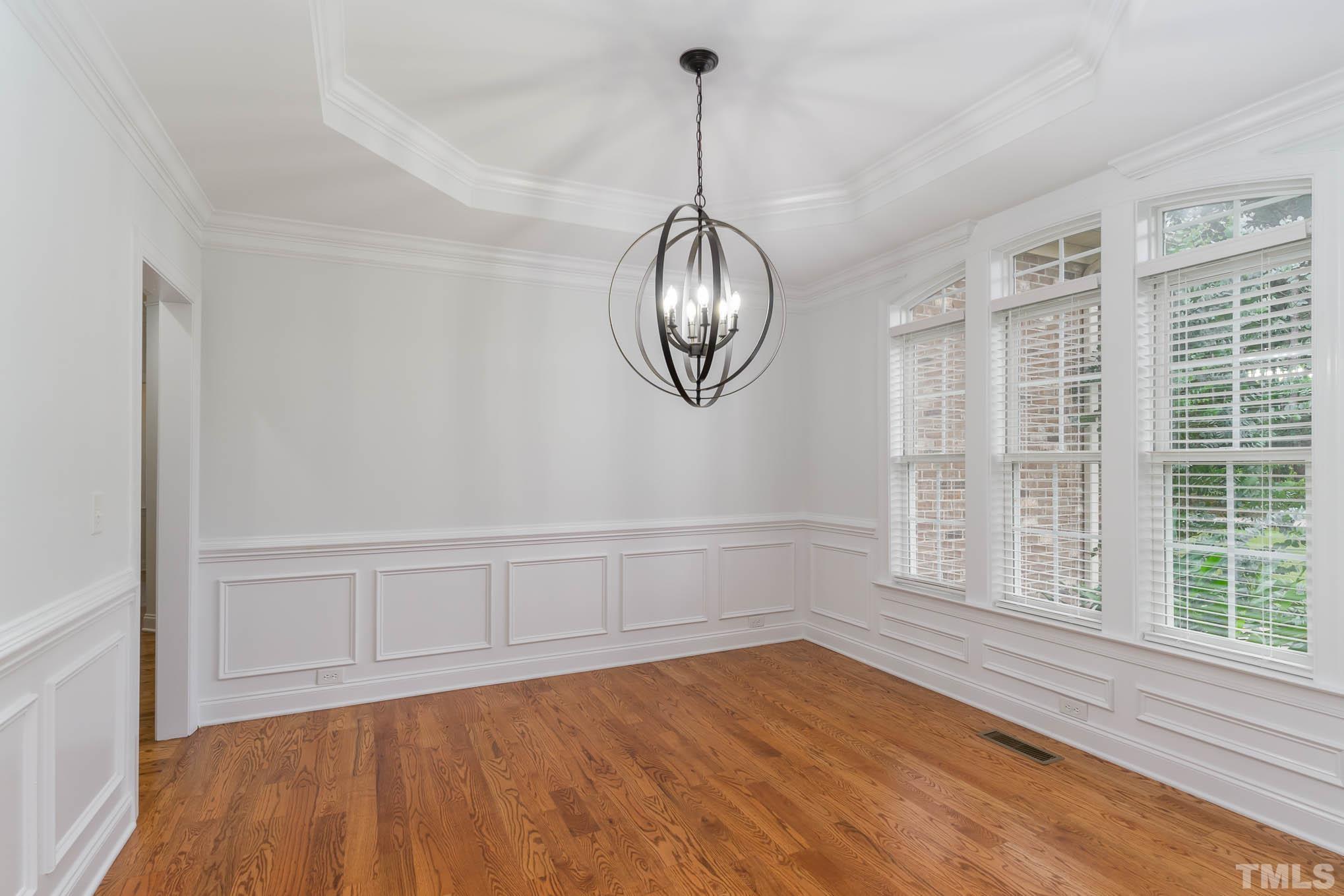 320 Government Road Clayton, NC 27520 - Photo 10 of 48 a view of empty room with wooden floor and fan