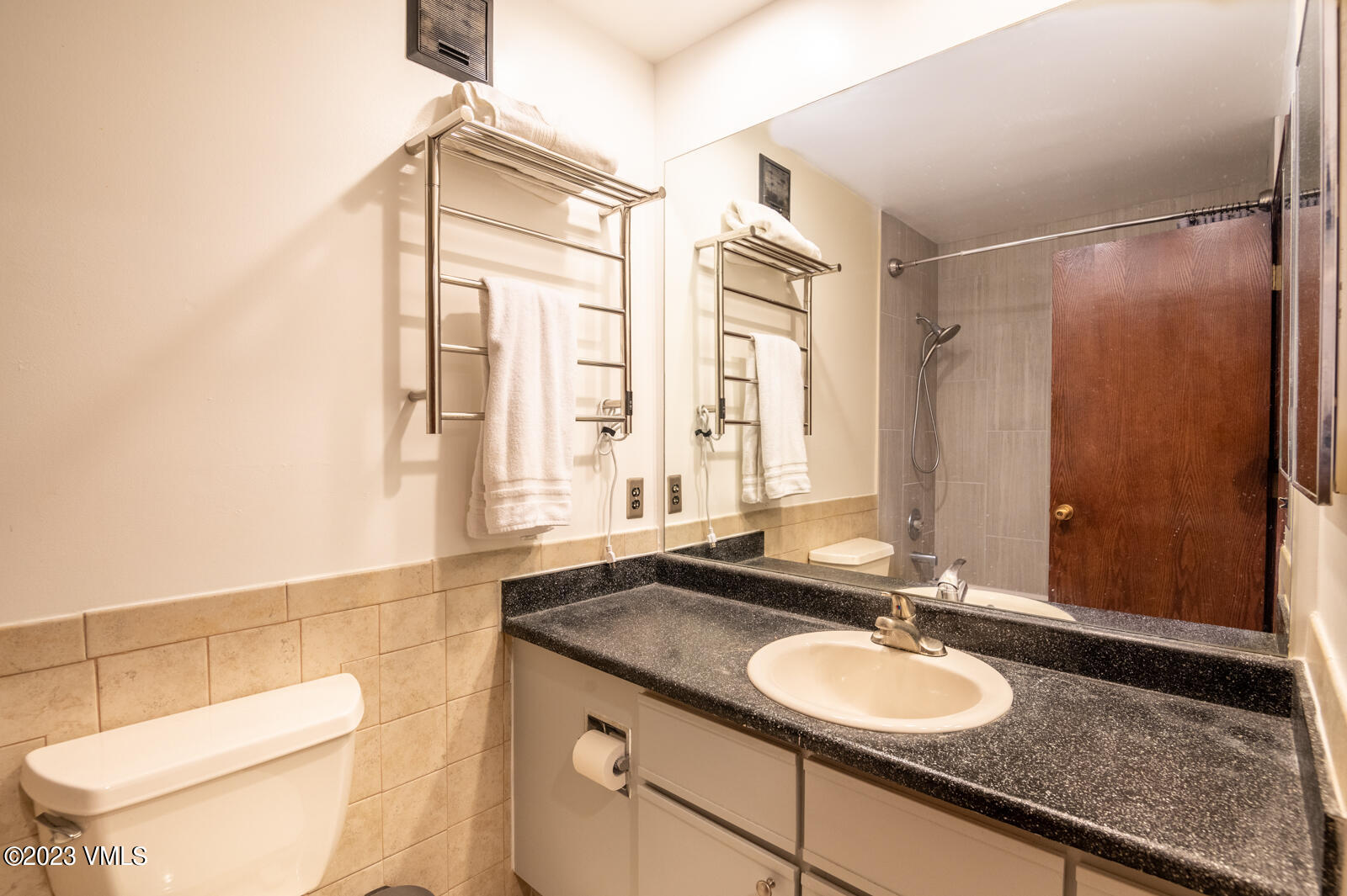 137 Benchmark Road, Unit 209 Avon, CO 81620 - Photo 13 of 20 a bathroom with a granite countertop sink toilet and shower