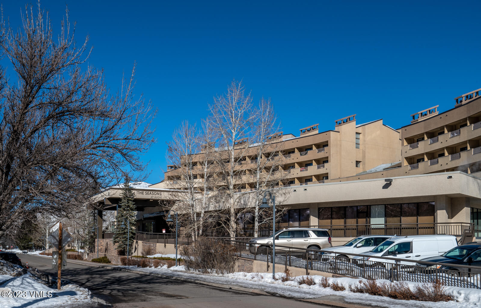 137 Benchmark Road, Unit 209 Avon, CO 81620 - Photo 14 of 20 a front view of a building with parking
