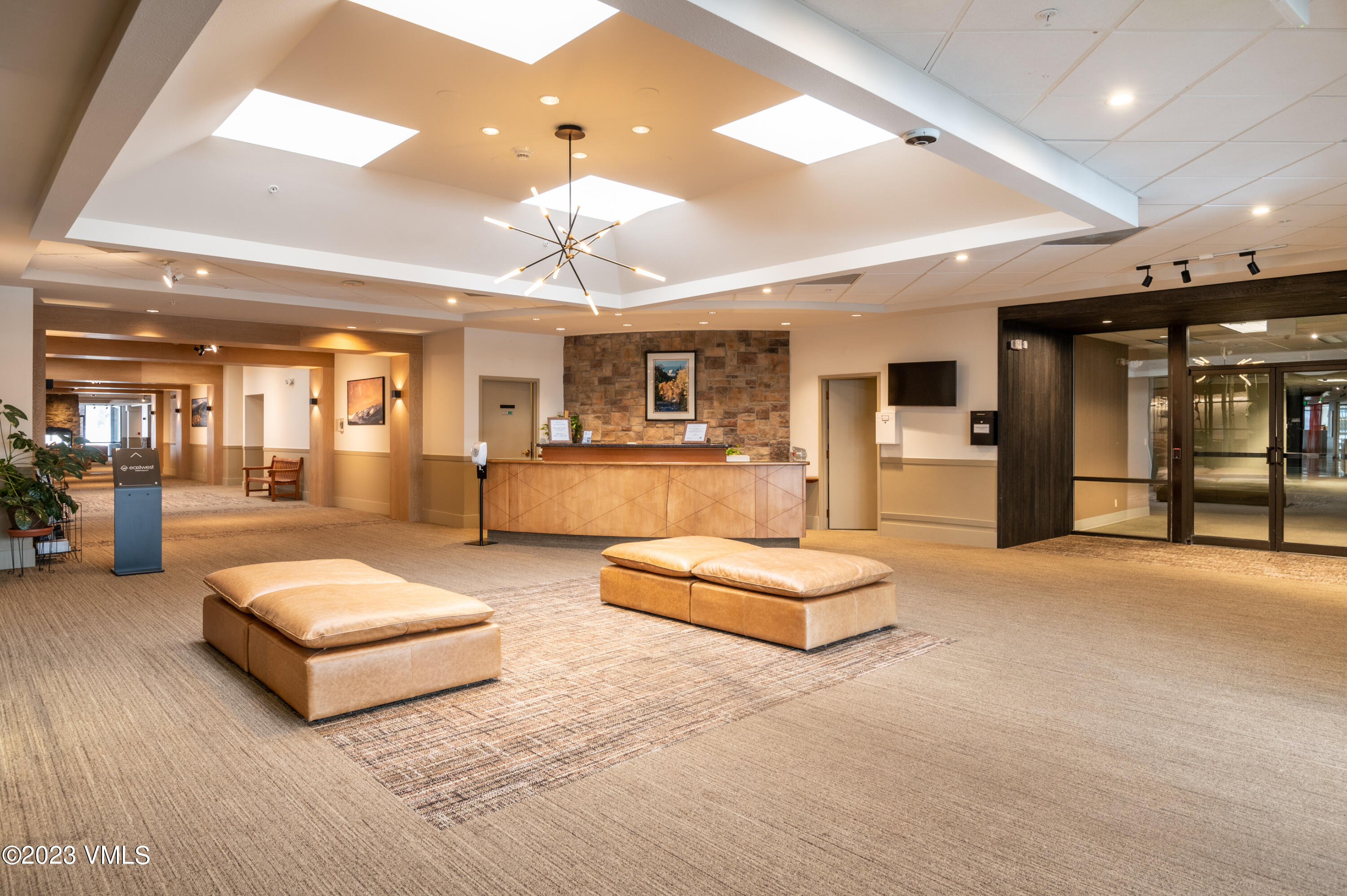 137 Benchmark Road, Unit 209 Avon, CO 81620 - Photo 17 of 20 a living room with furniture and kitchen view