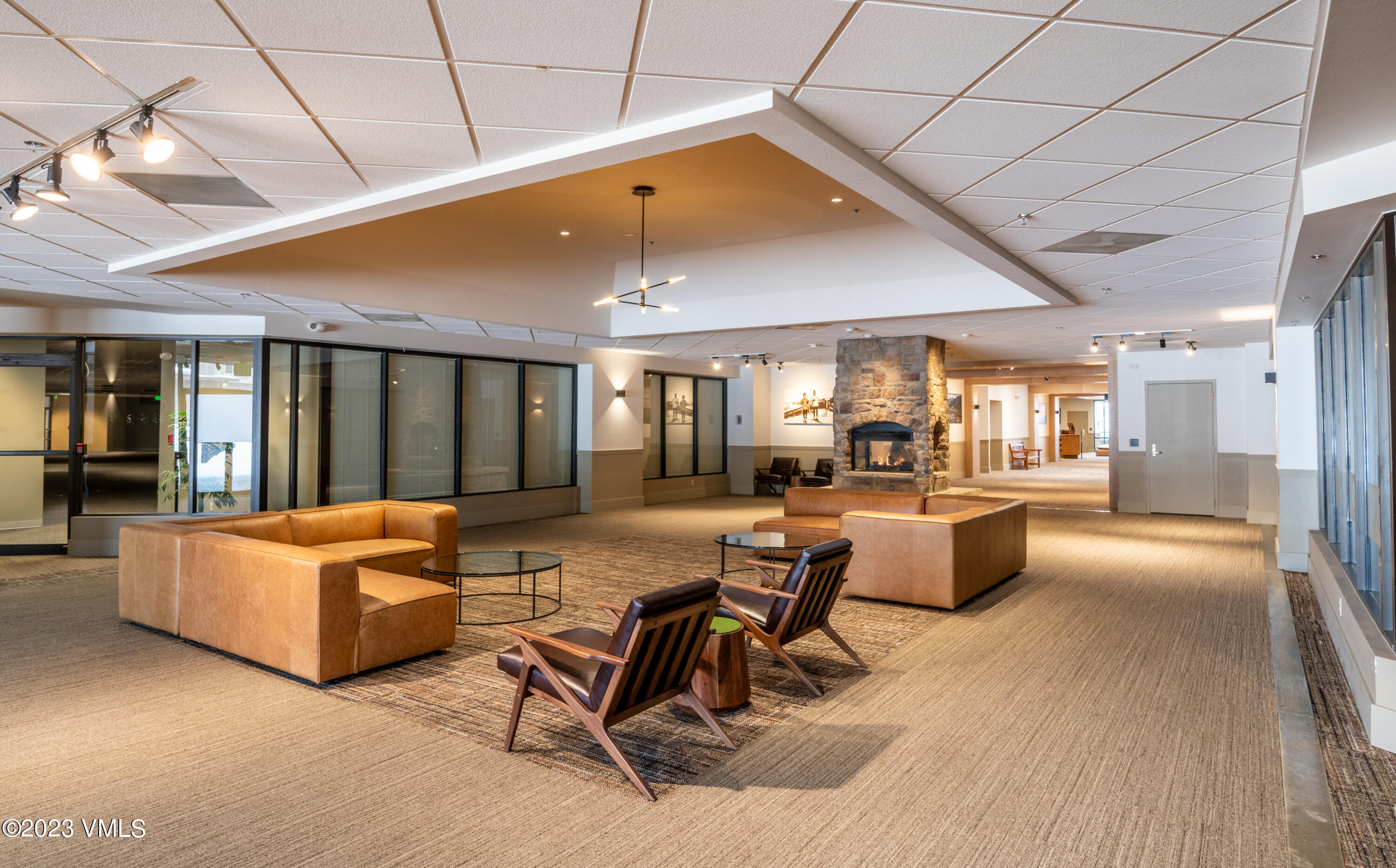 137 Benchmark Road, Unit 209 Avon, CO 81620 - Photo 19 of 20 a living room with furniture and a table