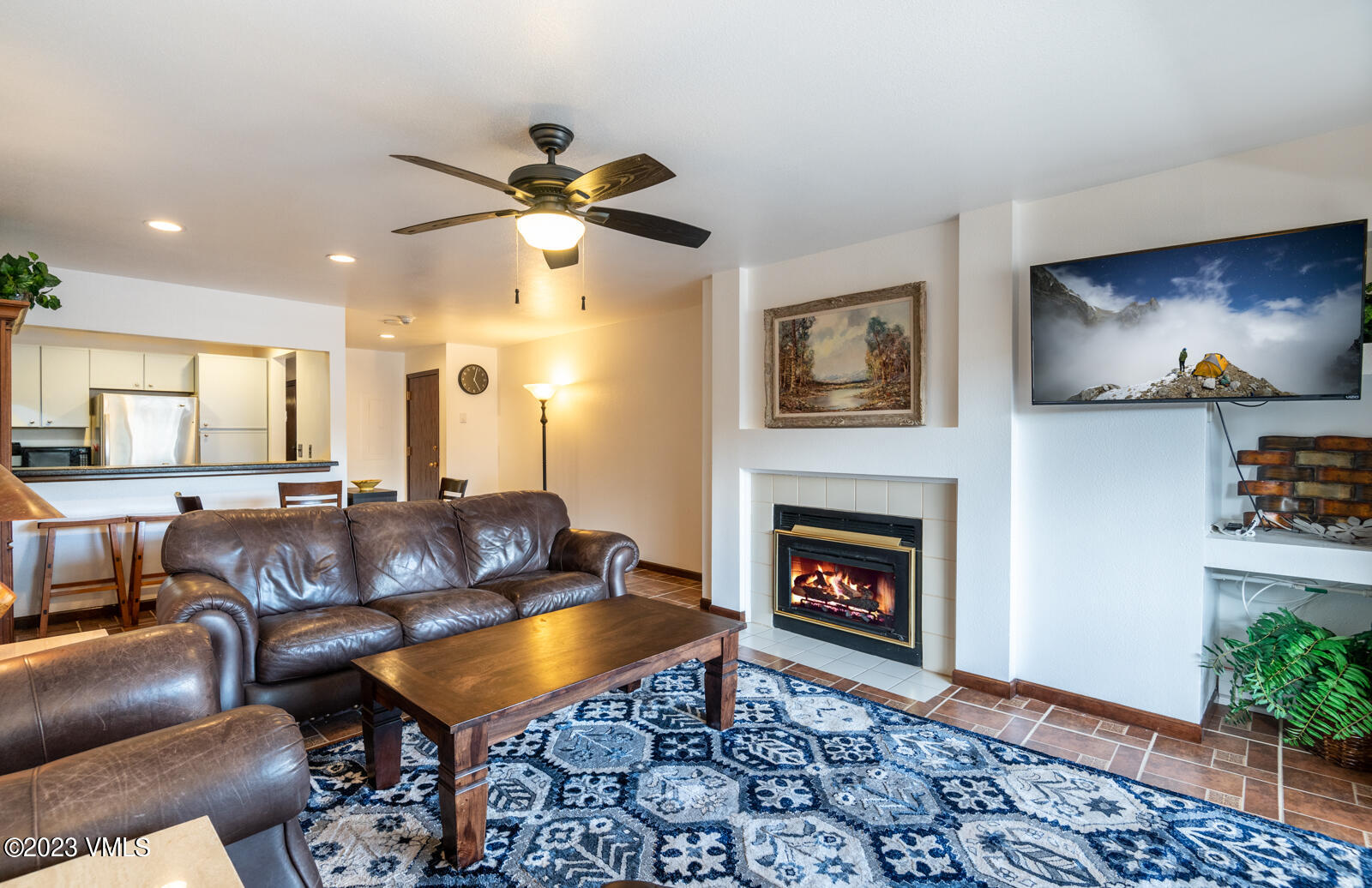 137 Benchmark Road, Unit 209 Avon, CO 81620 - Photo 5 of 20 a living room with furniture and a fireplace
