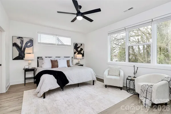 a bedroom with a bed and a couch