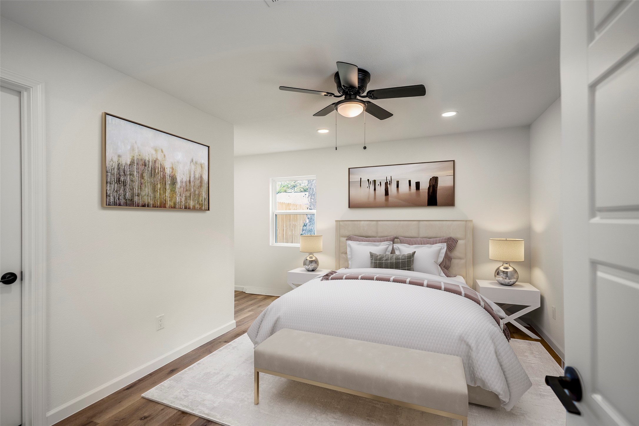 3923 Alsace Street Houston, TX 77021 - Photo 13 of 28 a bedroom with a large bed and a chandelier