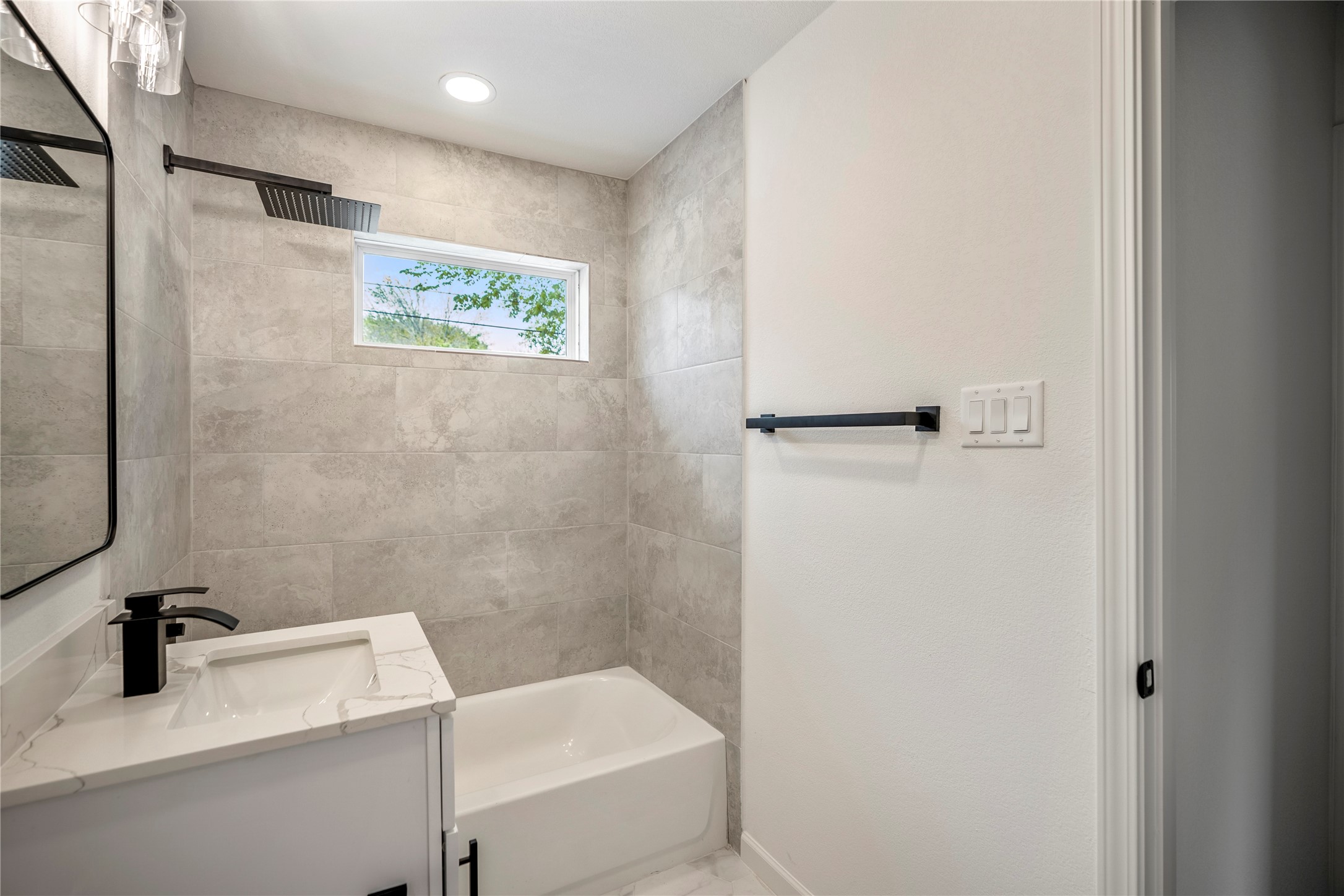 3923 Alsace Street Houston, TX 77021 - Photo 25 of 28 a bathroom with a sink a toilet and a mirror