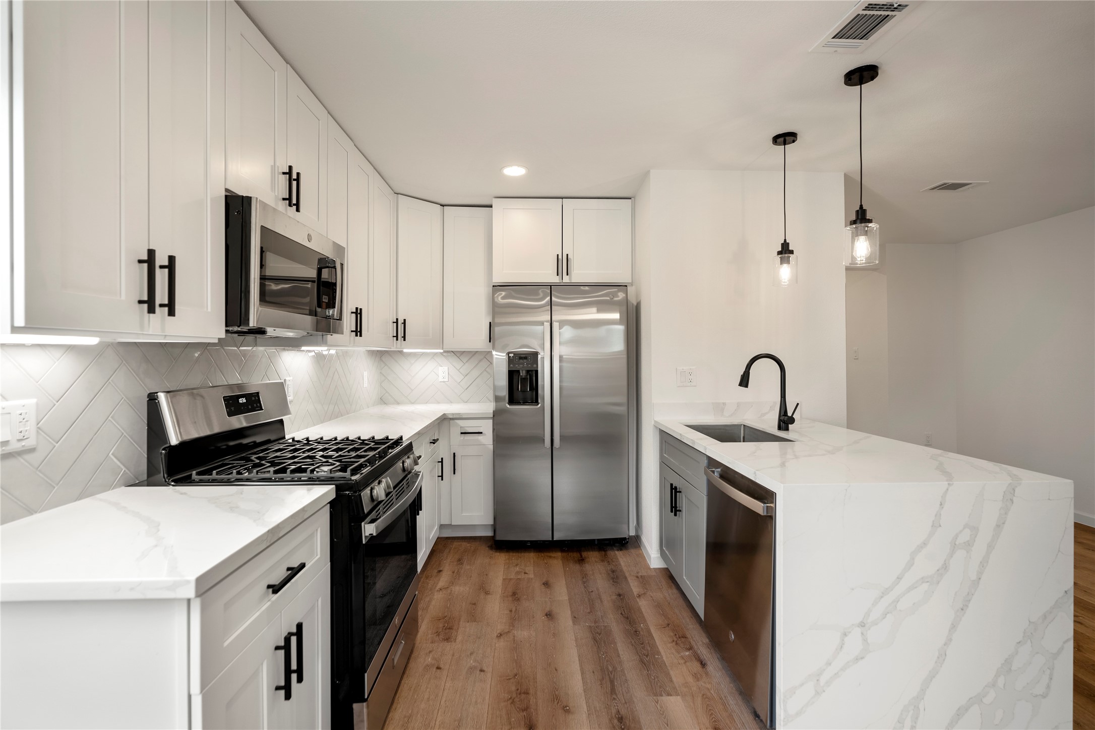 3923 Alsace Street Houston, TX 77021 - Photo 7 of 28 a kitchen with stainless steel appliances granite countertop a sink stove and refrigerator
