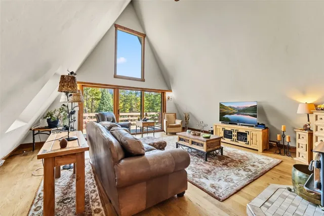 a living room with furniture and a rug