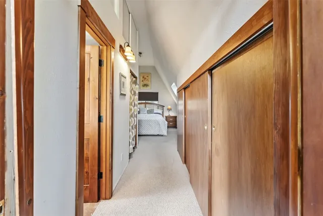 a view of an empty room and a window