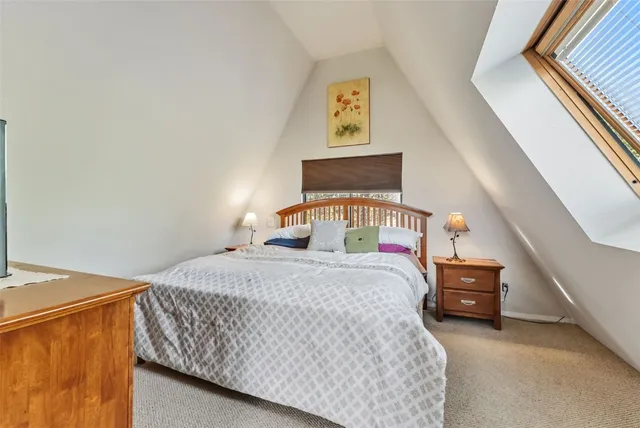 a bathroom with a sink a mirror and a shower curtain