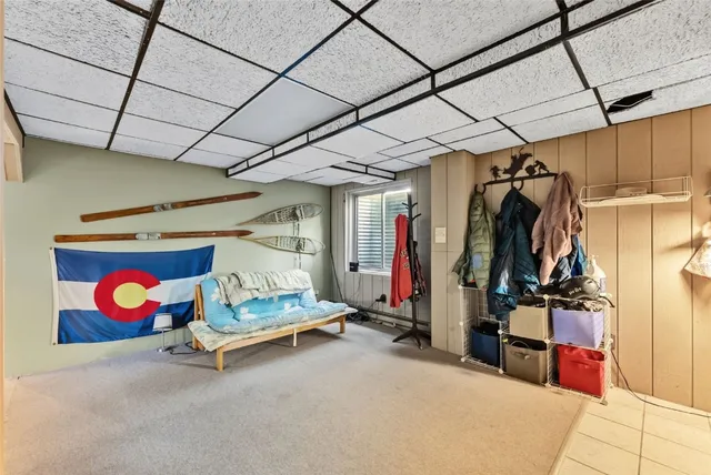 a view of a house with a yard and tree s