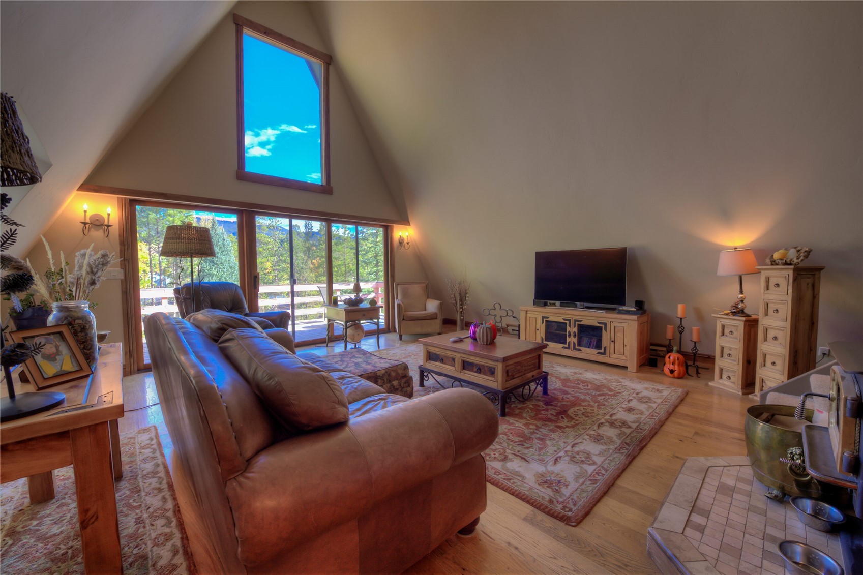 511 Vail Circle Dillon, CO 80435 - Photo 43 of 47 a living room with furniture a flat screen tv and a large window