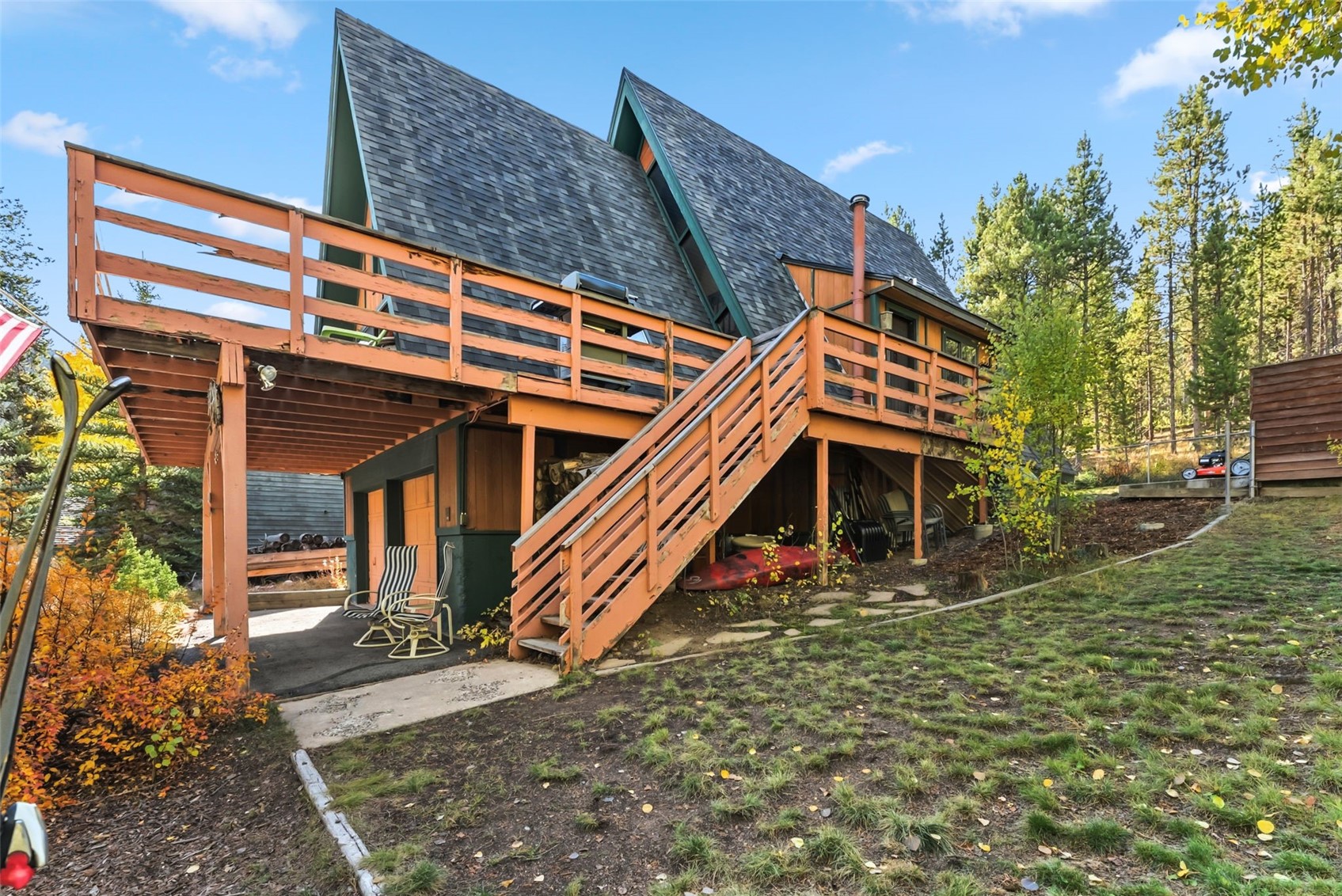511 Vail Circle Dillon, CO 80435 - Photo 45 of 47 Rear view of house with a wooden deck, a shingled roof, and stairway