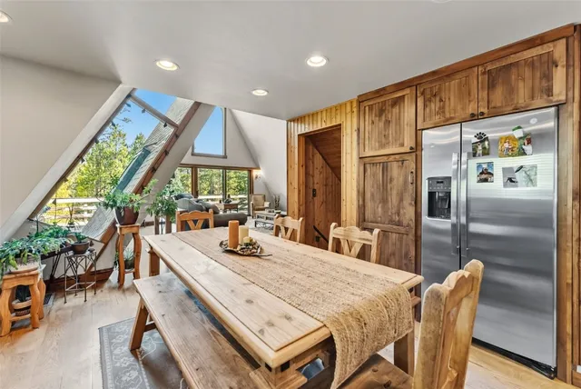 a bathroom with a granite countertop toilet a sink and a mirror