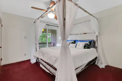 a bed room with a bed and a chandelier