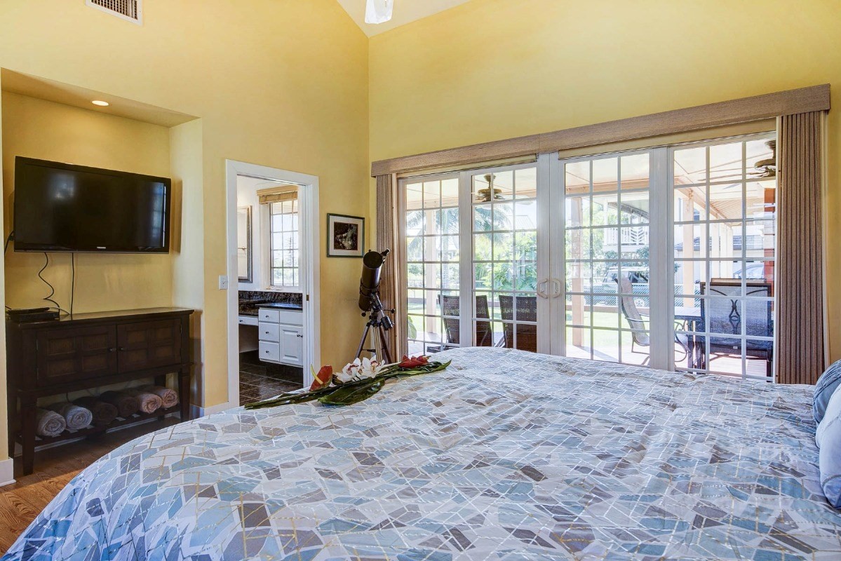 4526 Alae Road, Unit A Kekaha, HI 96752 - Photo 14 of 26 a living room with a flat screen tv and a fireplace