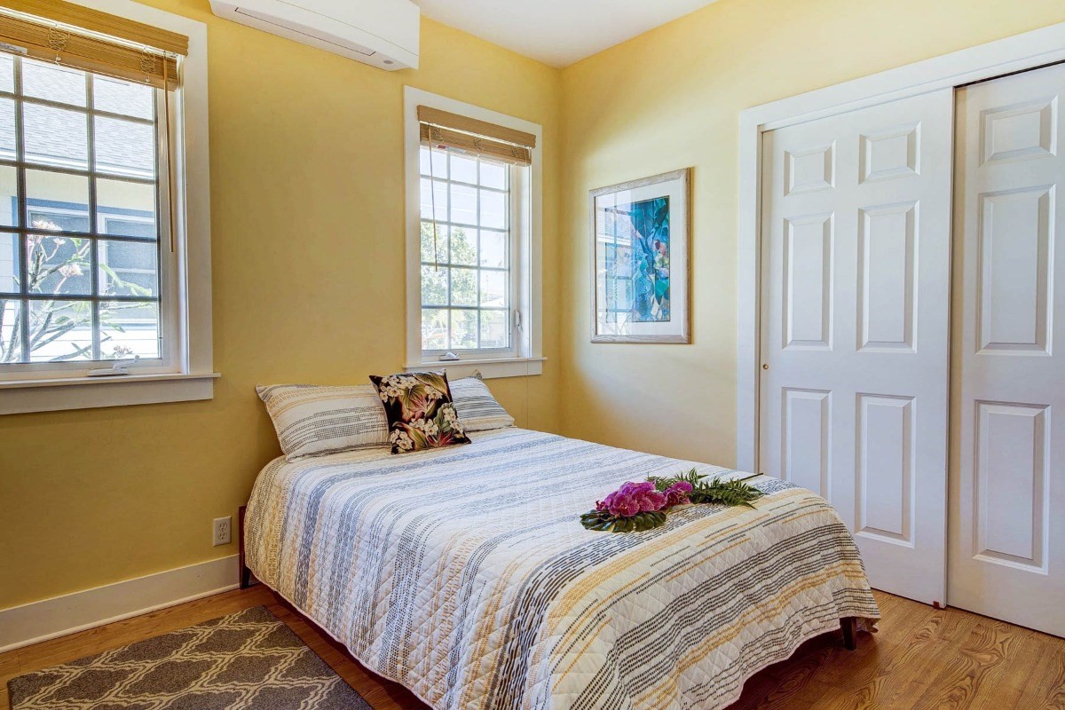 4526 Alae Road, Unit A Kekaha, HI 96752 - Photo 20 of 26 a bedroom with a bed and a window