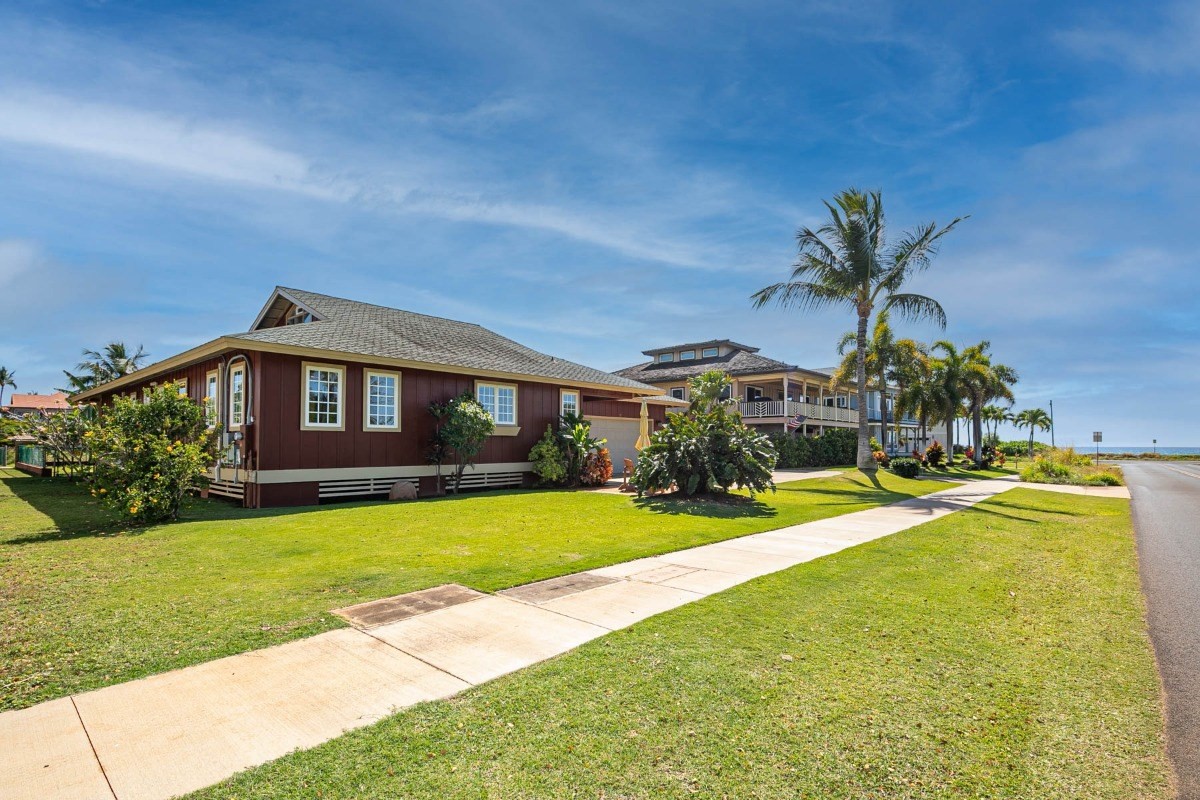 4526 Alae Road, Unit A Kekaha, HI 96752 - Photo 23 of 26 a front view of a house with swimming pool having outdoor seating