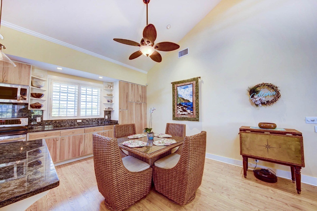 4526 Alae Road, Unit A Kekaha, HI 96752 - Photo 4 of 26 a view of a dining room with furniture window and wooden floor