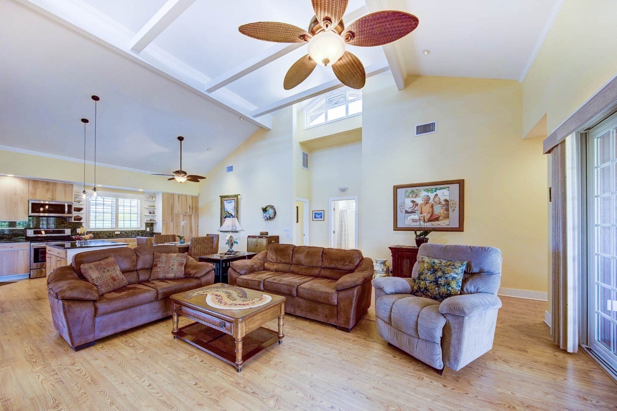 4526 Alae Road, Unit A Kekaha, HI 96752 - Photo 6 of 26 a living room with furniture kitchen view and a chandelier