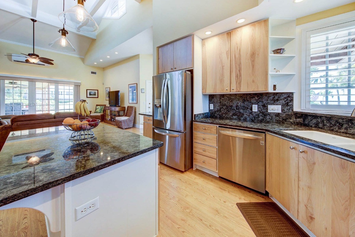 4526 Alae Road, Unit A Kekaha, HI 96752 - Photo 10 of 26 a kitchen with stainless steel appliances granite countertop a sink a stove and a refrigerator