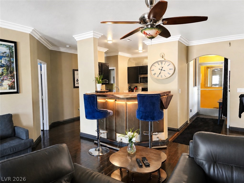 2050 West Warm Springs Road, Unit 2422 Henderson, NV 89014 - Photo 8 of 44 This inviting living space features an elegant bar area, perfect for entertaining guests.